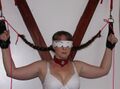Blindfolded and with tied hair braids at the Saint Andrews Cross.jpg
