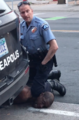 George Floyd neck knelt on by police officer.png