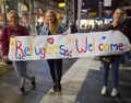 Refugees-Welcome-Banner-by-German-Girls.jpg