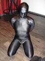 Submissive male in Zentai BDSM suit.jpg